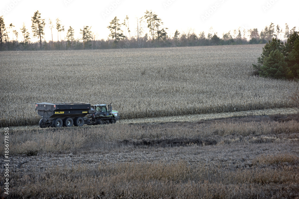 Kyiv, Ukraine, 10.12.2025. tractor with a grain trailer on an ...