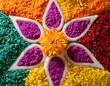 © Hallie - close up of rangoli pattern made with colored rice and flowers top view