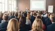 © Basir  - Audience attending a presentation in a conference room setting
