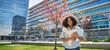 © insta_photos - Happy smiling African American girl student standing outside university looking at camera outdoors, portrait. Applying foreign university, study abroad, admission and scholarship program. Banner