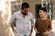 © kleberpicui - Father and teenage son walk side by side in a quiet residential area, having an open conversation about life, emotions, and wellbeing, representing trust, guidance, and mental health support