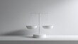 © buraratn - Minimalist design of a white balance scale on a plain surface, representing justice, fairness, equality, and decision-making in a serene environment