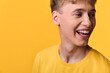 © SHOTPRIME STUDIO - Kid in a bright yellow shirt laughs against a vivid yellow backdrop, capturing cheerful energy, warmth, and spontaneous joy ideal for lifestyle, youth, and positive messaging