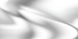 © Rafi - Luxury liquid silver texture with smooth flowing waves. Metallic gradient on wavy curve surface. Glossy reflective mercury or chrome material. Silver material