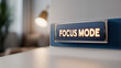© A2Z AI  - Illuminated 'Focus Mode' sign on a wall, creating a productive and distraction-free atmosphere in a modern workspace or home office. Motivation for concentration.