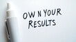 © A2Z AI  - Empowering message displayed with a marker on a whiteboard reads: 'Own Your Results,' encouraging personal responsibility and accountability. A minimalist, motivational reminder.