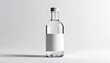 © Nidae - “Clear glass bottle with silver cap blank white label isolated on plain background modern packaging mockup”