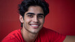 © Bernd Schmidt - Portrait young man dark hair bright smile vibrant red t-shirt bold red background high-quality photography facial features dark eyebrows bright teeth smooth skin natural pose head generative AI