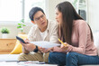 © KMPZZZ - Stressed financial owe asian young couple love sitting suffer, stressed and confused by calculate expense from credit card bill, no money to pay, mortgage or loan. Debt, bankrupt or bankruptcy people.