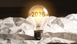 © DelightGrid - Glowing light bulb with “2026” inside, floating above abstract low-poly landscape, warm sunrise tones, futuristic concept, innovation and new year vision, cinematic atmosphere.