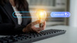 © InfiniteFlow - A hand holding a glowing light bulb above a computer keyboard, symbolizing innovation and creative ideas in a modern business and technology workspace. Gantry