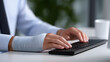 © Moddy - Injured Hand Typing on Keyboard: Close-up of an injured person typing on a keyboard, highlighting the challenges of working with a bandaged wrist.