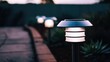 © Luba - Modern Solar Garden Path Lights Illuminating Walkway at Dusk