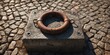 © AbstractAI - Old rusty metal mooring ring attached to a stone block with midday sunlight casting shadows, corrosion and surface texture
