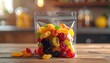 © baa - Assorted Gummy Candies In A Clear Plastic Bag On A Wooden Surface With A Blurred Kitchen Background And Warm Lighting