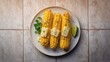 © vxnaghiyev - Top view of corn cobs grilled with butter cheese and herbs, food styling, outdoor cooking, World Food Day