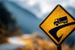 © Fauzan - A yellow road sign warns of a steep downhill grade ahead, featuring a truck illustration