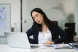 © NINENII - Businesswoman overworked with fatigue.