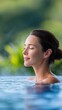 © ISVO - Serene woman with closed eyes enjoying a tranquil moment in a luxurious pool surrounded by lush greenery, embodying relaxation and peace in a natural setting