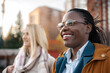© Jelena - Diverse friends enjoying time outdoors in city