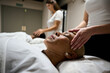 © alvaro - Woman receiving head massage for relaxation and wellness