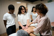© alvaro - Students learning massage techniques in holistic therapy class