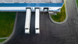 © Polivan - trucks are loaded in a modern logistics center. aerial view.