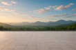 © azizahmad - Serene elevated terrace offering a magnificent panoramic view of lush green mountains under a golden sunrise sky