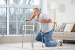 © Pixel-Shot - Senior man with walker falling at home