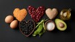 © mila103 - Different kinds of food are arranged in heart shapes on a black table. Ingredients include beans grains eggs oil and greens. This shows healthy choices for meals and snacks.