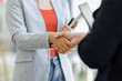 © David - Happy business asian manager handshaking client at meeting. Smiling female hr hiring recruit at job interview, insurance agent, lawyer making contract deal at work with business handshake.