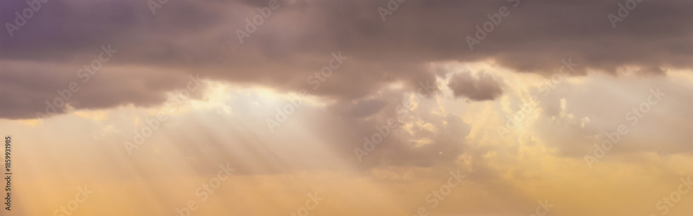 Golden rays of sunlight streaming through heavy violet clouds, illuminating the sky with warm amber tones and creating a sacred, ethereal atmosphere of hope breaking through darkness

