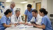 © Nathan - Diverse group of medical professionals collaborating in a hospital meeting room.