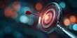 © Rifqi - Red arrow hitting the glowing bullseye center of a metallic spiral target in a dark bokeh environment, concept for marketing strategy, achieving business goals and performance measurement optimization