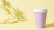 © Playful - soft lavender coffee cup with a white lid on a light pastel yellow tabletop