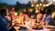 © decorator - Warm twilight illuminates joyful friends sharing an alfresco dinner celebrating connection and a simple shared moment