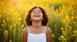 © Wajid Ali - A joyful young girl laughs with her eyes closed in a field of yellow wildflowers, a pure and happy concept of childhood freedom, nature, and simple bliss