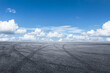 © zhao dongfang - Empty asphalt road and blue sky with clouds background.