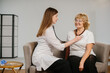 © dsheremeta - Nurse checking senior woman's health before vaccination