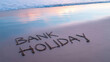 © jpg,png,eps stock - Bank holiday message written in wet sand on beach with ocean waves
