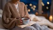 © Tania - A person journaling by candlelight with a warm cup of herbal tea, creating a moment of reflection and inner peace — wholesome self-care and mindful evening ritual. cinematic color correction,