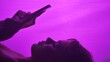 © kinomaster - Silhouette of woman using a smartphone against a vibrant pink backdrop, highlighting digital interaction.