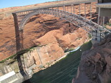 Glen Canyon Bridge casting shadow over dam and canyon
