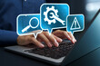 © tadamichi - Online IT customer support. Remote help desk chat for technical support. Businessman using laptop computer to provide troubleshooting support.