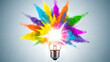 © creative - Creative concept light bulb explodes with colorful water colors on a light blue background. Think different, creative idea. Productivity and creativity