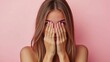 © Mehak - Woman with long hair and painted nails covering her face with hands against a soft pink backdrop, representing emotions and introspection.