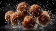 © Abdul - Glazed dough balls slam together, sugar shards flying in frozen mid-motion. The glossy textures reflect controlled lighting, ensuring a