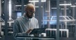 © Framestock - Technician Using Tablet For Asset Management in Data Center. Man Check Assets in Server Hall. Female Colleague is Walking in Background. Concept of Interactive Asset Management and IT Workflow.