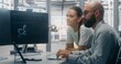 © Framestock - Focused Specialists Monitoring Factory Automation Work. Male and Female Technical Specialist Monitoring Real Time Factory Automation on Dual Screen Workstation. Process Control, Technical Oversight.
