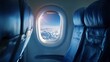 © Mitchell - Aerial view from airplane window showing clouds and blue sky
